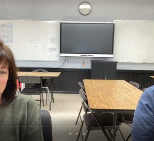 photo of two people in a classroom, Zoom photo.