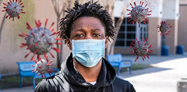 Student looking at the camera with mask on