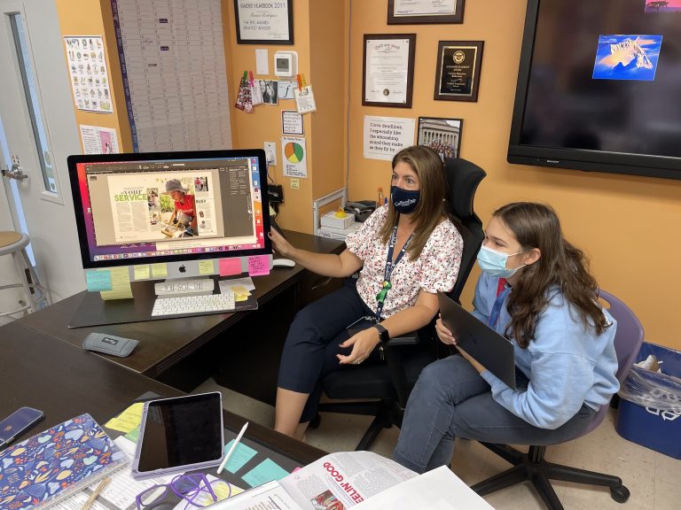 Rodriguez helping students at computer